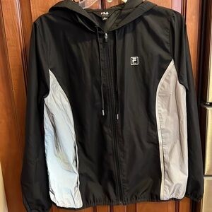 Fila Sport light zippered jacket w/ two side pockets and a hood. Woman’s Medium.